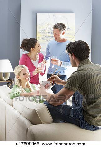 Group Of Friends Enjoying Chinese Takeaway Meal At Home View Large Photo Image Stock Photograph - Group Of Friends Enjoying Chinese Takeaway Meal At Home. Fotosearch