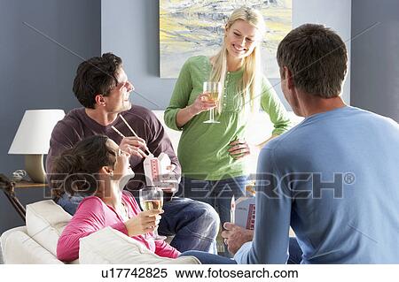 Group Of Friends Enjoying Chinese Takeaway Meal At Home View Large Photo Image Stock Photography - Group Of Friends Enjoying Chinese Takeaway Meal At Home. Fotosearch