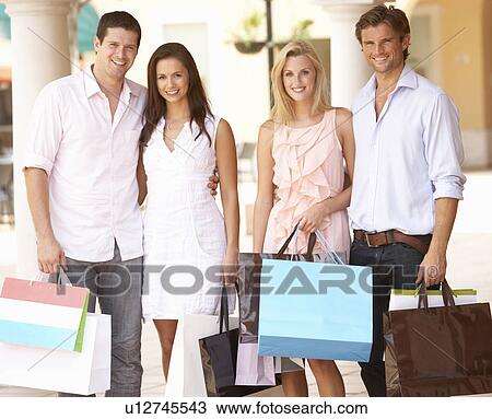 Group Of Friends Enjoying Shopping Trip Together View Large Photo Image Stock Image - Group Of Friends Enjoying Shopping Trip Together. Fotosearch