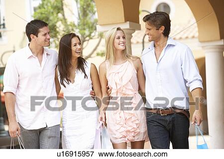 Stock Photo - Group Of Friends Enjoying Shopping Trip Together. Fotosearch