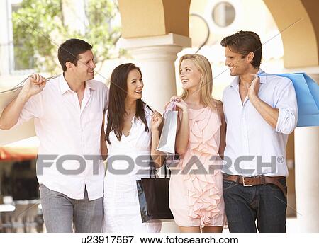 Stock Photo - Group Of Friends Enjoying Shopping Trip Together. Fotosearch