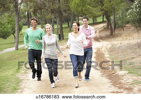 Group Of Friends having fun in park View Large Photo Image Stock Image - Group Of Friends having fun in park. Fotosearch