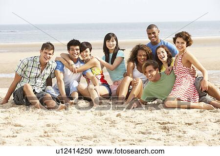 Group Of Friends Sitting On Beach Together View Large Photo Image Stock Image - Group Of Friends Sitting On Beach Together. Fotosearch