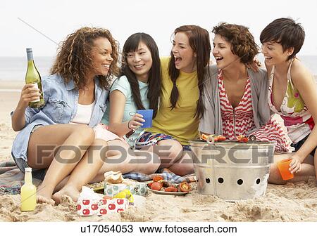Group Of Girls Enjoying Barbeque On Beach Together View Large Photo Image Stock Image - Group Of Girls Enjoying Barbeque On Beach Together. Fotosearch
