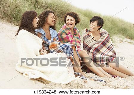 Group Of Girls Sitting On Beach Together View Large Photo Image Stock Photo - Group Of Girls Sitting On Beach Together. Fotosearch