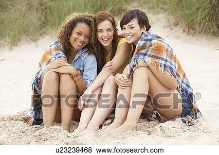 Group Of Girls Sitting On Beach Together View Large Photo Image Stock Photo - Group Of Girls Sitting On Beach Together. Fotosearch