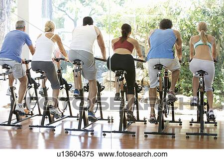 Stock Photography - Group Of People In Spinning Class In Gym. Fotosearch