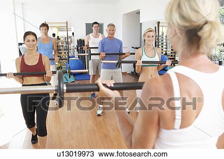 Group Of People Lifting Weights In Gym View Large Photo Image Stock Image - Group Of People Lifting Weights In Gym. Fotosearch