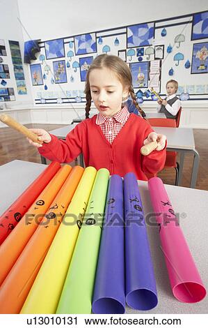 Group Of Primary Schoolchildren Having Music Lesson In Classroom View Large Photo Image Stock Image - Group Of Primary Schoolchildren Having Music Lesson In Classroom. Fotosearch