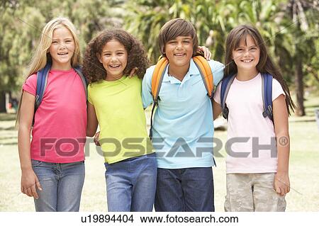 Group Of Schoolchildren Standing In Park View Large Photo Image Picture - Group Of Schoolchildren Standing In Park. Fotosearch