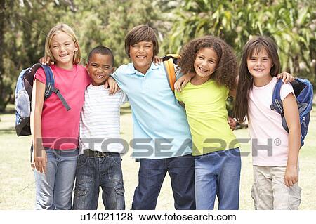 Stock Photo - Group Of Schoolchildren Standing In Park. Fotosearch