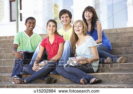 Group Of Teenage Friends Sitting On College Steps Outside View Large Photo Image Picture - Group Of Teenage Friends Sitting On College Steps Outside. Fotosearch