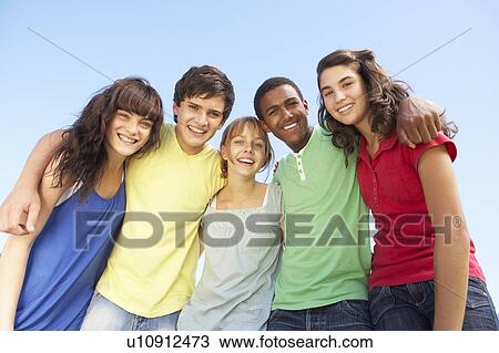 Group Of Teenage Friends Standing Outside View Large Photo Image Stock Image - Group Of Teenage Friends Standing Outside. Fotosearch