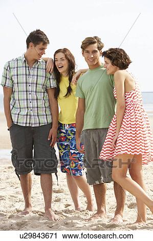 Group Of Teenage Friends Together On Beach View Large Photo Image Stock Image - Group Of Teenage Friends Together On Beach . Fotosearch