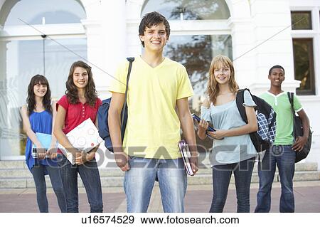 Stock Photo - Group Of Teenage Students Standing Outside College Building. Fotosearch