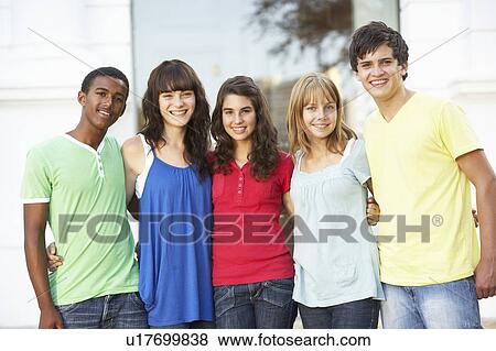 Stock Photo - Group Of Teenage Students Standing Outside College Building. Fotosearch