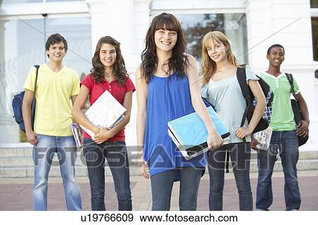 Stock Photo - Group Of Teenage Students Standing Outside College Building. Fotosearch