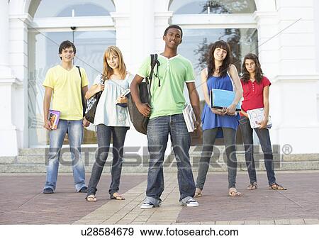 Stock Photo - Group Of Teenage Students Standing Outside College Building. Fotosearch