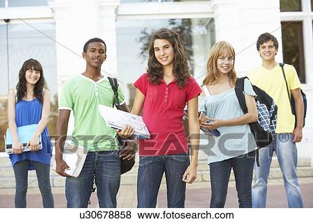 Stock Photo - Group Of Teenage Students Standing Outside College Building. Fotosearch