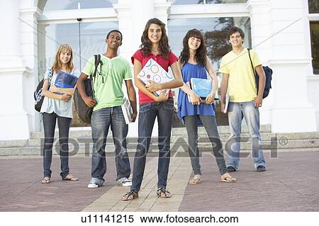 Stock Photography - Group Of Teenage Students Standing Outside College Building. Fotosearch