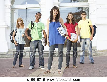 Stock Photography - Group Of Teenage Students Standing Outside College Building. Fotosearch