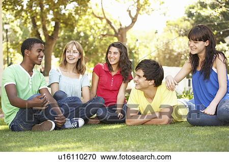 Group Of Teenagers Chatting Together In Park View Large Photo Image Stock Image - Group Of Teenagers Chatting Together In Park. Fotosearch