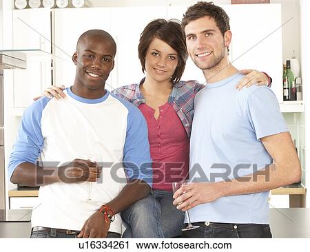 Group Of Young Friends Enjoying Glass Of Wine In Modern Kitchen View Large Photo Image Stock Image - Group Of Young Friends Enjoying Glass Of Wine In Modern Kitchen. Fotosearch