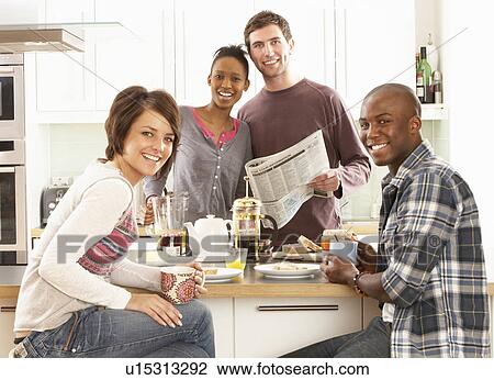 Group Of Young Friends Preparing Breakfast In Modern Kitchen View Large Photo Image Stock Image - Group Of Young Friends Preparing Breakfast In Modern Kitchen. Fotosearch