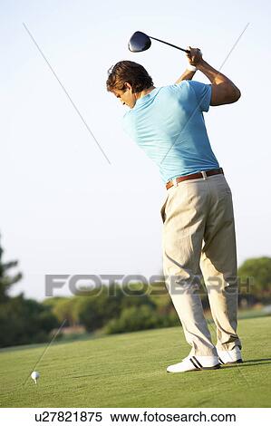 Male Golfer Teeing Off On Golf Course View Large Photo Image Stock Photography - Male Golfer Teeing Off On Golf Course. Fotosearch