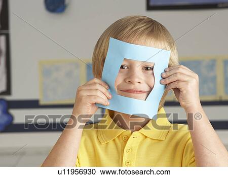 Male Primary School Cutting Out Paper Shapes In Craft Lesson View Large Photo Image Stock Image - Male Primary School Cutting Out Paper Shapes In Craft Lesson. Fotosearch