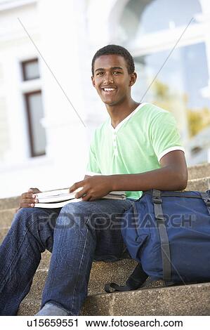 Male Teenage Student Sitting Outside On College Steps View Large Photo Image Stock Image - Male Teenage Student Sitting Outside On College Steps. Fotosearch