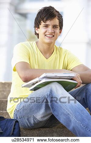 Male Teenage Student Sitting Outside On College Steps View Large Photo Image Stock Image - Male Teenage Student Sitting Outside On College Steps. Fotosearch