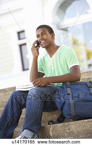 Male Teenage Student Sitting Outside On College Steps View Large Photo Image Stock Photography - Male Teenage Student Sitting Outside On College Steps. Fotosearch
