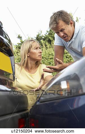 Man And Woman Having Argument After Traffic Accident View Large Photo Image Picture - Man And Woman Having Argument After Traffic Accident. Fotosearch