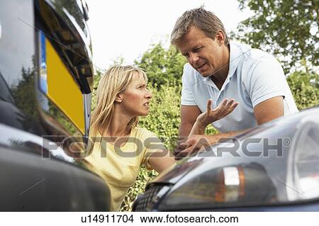 Man And Woman Having Argument After Traffic Accident View Large Photo Image Picture - Man And Woman Having Argument After Traffic Accident. Fotosearch