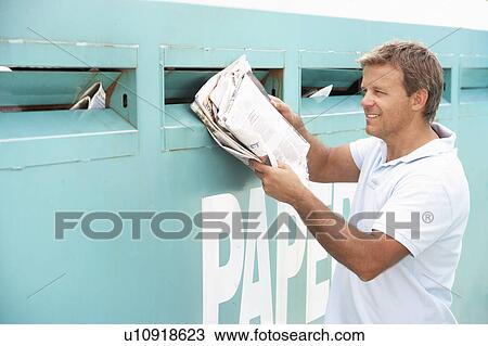 Man At Recycling Centre Disposing Of Old Newspapers View Large Photo Image Stock Image - Man At Recycling Centre Disposing Of Old Newspapers. Fotosearch