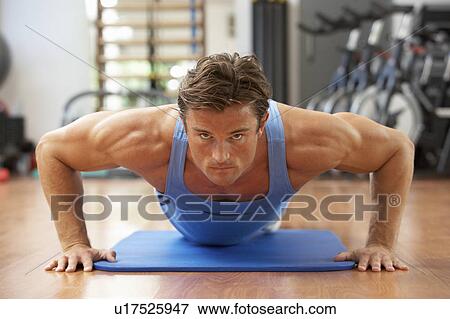 Man Doing Press Ups In Gym View Large Photo Image Stock Photo - Man Doing Press Ups In Gym. Fotosearch