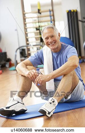 Man Resting After Exercises In Gym View Large Photo Image Stock Photo - Man Resting After Exercises In Gym. Fotosearch