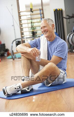 Man Resting After Exercises In Gym View Large Photo Image Stock Photography - Man Resting After Exercises In Gym. Fotosearch