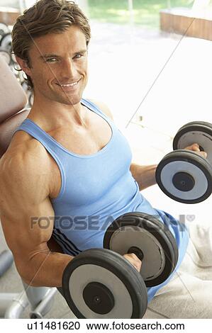 Man Working With Weights In Gym View Large Photo Image Stock Image - Man Working With Weights In Gym. Fotosearch