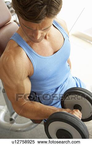 Man Working With Weights In Gym View Large Photo Image Stock Photography - Man Working With Weights In Gym. Fotosearch