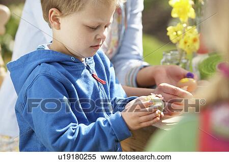 Mother And Children Decorating Easter Eggs On Table Outdoors View Large Photo Image Stock Photography - Mother And Children Decorating Easter Eggs On Table Outdoors . Fotosearch
