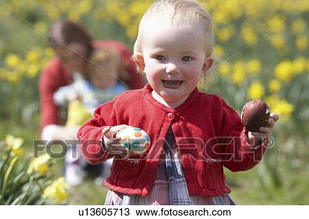 Mother And Children In Daffodil Field With Decorated Easter Eggs View Large Photo Image Stock Image - Mother And Children In Daffodil Field With Decorated Easter Eggs. Fotosearch