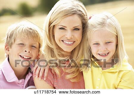 Mother And Children Sitting On Straw Bales In Harvested Field View Large Photo Image Picture - Mother And Children Sitting On Straw Bales In Harvested Field. Fotosearch
