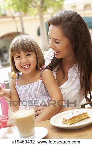Mother And Daughter Enjoying Cup Of Coffee And Piece Of Cake In Café View Large Photo Image Stock Image - Mother And Daughter Enjoying Cup Of Coffee And Piece Of Cake In Café. Fotosearch