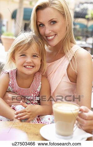 Mother And Daughter Enjoying Cup Of Coffee And Piece Of Cake In Café View Large Photo Image Stock Photograph - Mother And Daughter Enjoying Cup Of Coffee And Piece Of Cake In Café. Fotosearch