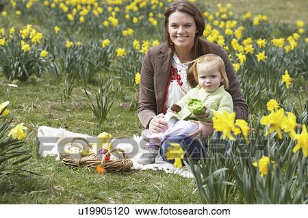 Mother And Daughter In Daffodil Field With Decorated Easter Eggs View Large Photo Image Stock Image - Mother And Daughter In Daffodil Field With Decorated Easter Eggs. Fotosearch