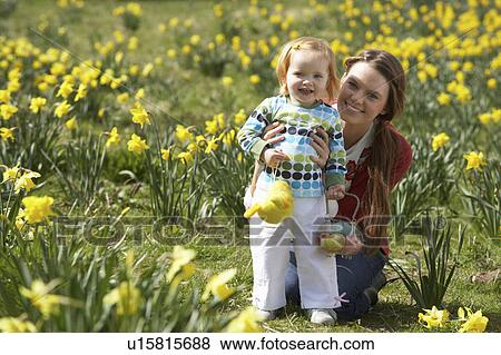 Mother And Daughter In Daffodil Field With Decorated Easter Eggs View Large Photo Image Stock Photo - Mother And Daughter In Daffodil Field With Decorated Easter Eggs. Fotosearch