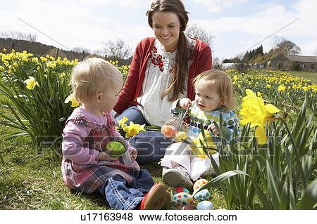 Mother And Daughter In Daffodil Field With Decorated Easter Eggs View Large Photo Image Stock Photo - Mother And Daughter In Daffodil Field With Decorated Easter Eggs. Fotosearch