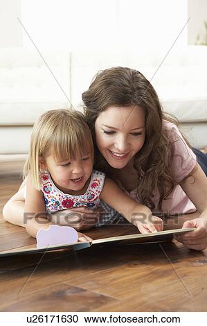 Mother And Daughter Learning To Read At Home View Large Photo Image Stock Image - Mother And Daughter Learning To Read At Home. Fotosearch